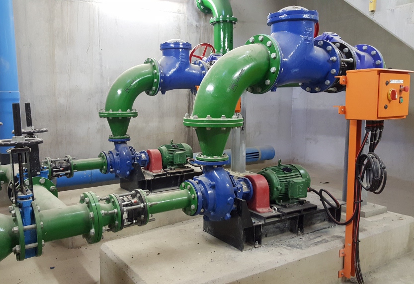 Industrial pump station with motors, pipework and control panel