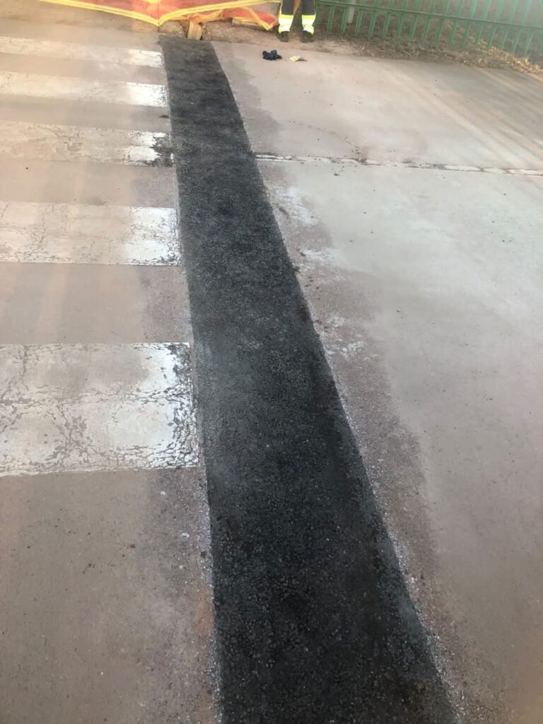 Industrial service corridor with pipework and lighting